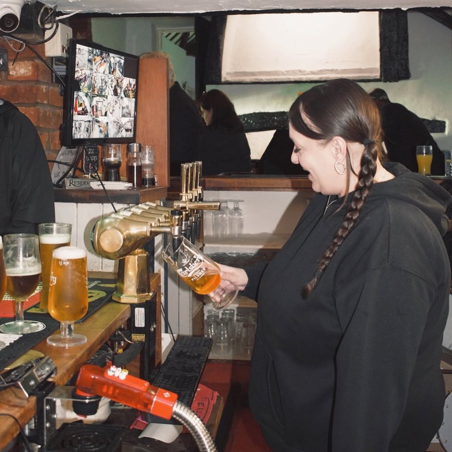 Pulling pints at the bar
